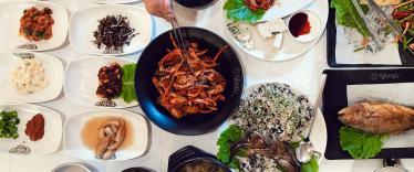 Eating Korea food with chopsticks 