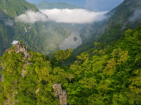 Aerial view of the dramatic forest-covered karst rock formations near Nong Khiaw in northern Laos
