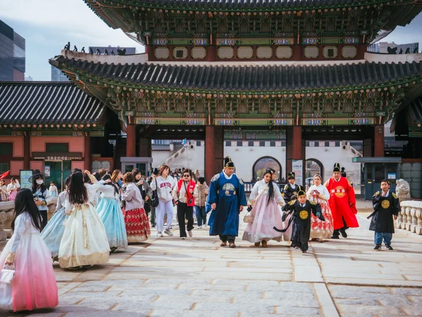 Seoul palace in November with people wearing traditional hanbok 
