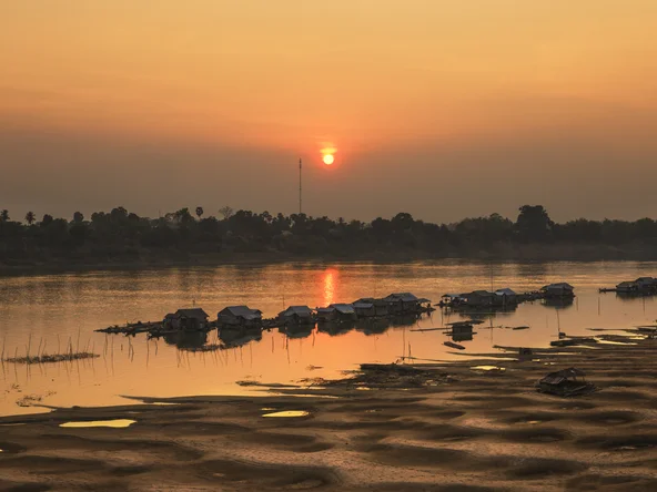 A village on stilts in Kratie as the sun sets in Cambodia