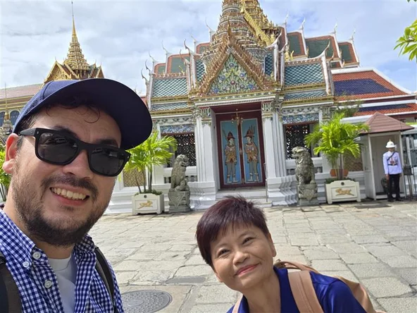 Client and guide outside a temple in Bangkok