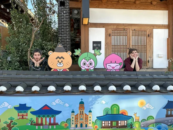Two staff members with cute characters
