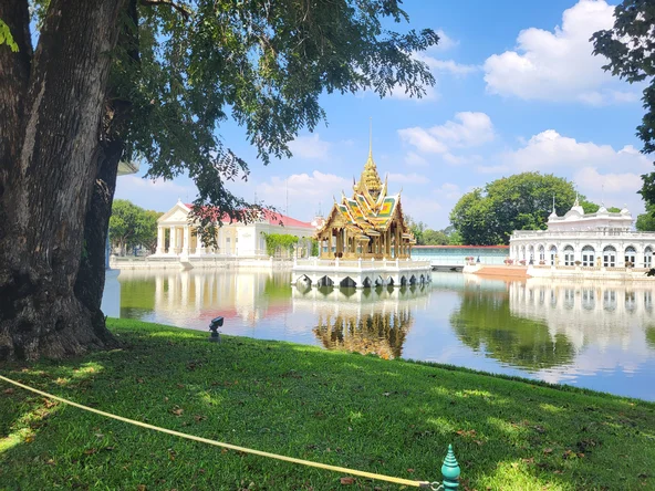 An intricate temple sits in the middle of a lake