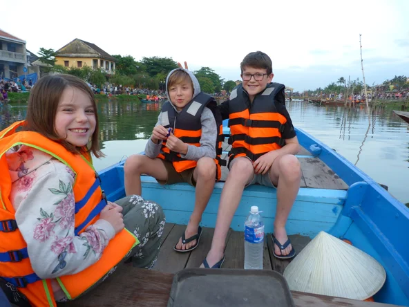 Kids on a boat in Hoi An, Vietnam