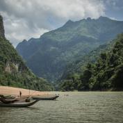 Canoes on a beach at Nong Khiaw