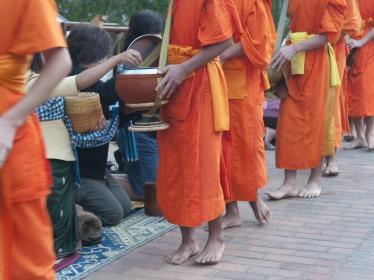 Handing out alms in Luang Prabang - iStock - ©leezsnow