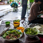 Eating Pho on the streets of Hanoi 