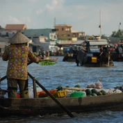 Woman in boat on Mekong Delta