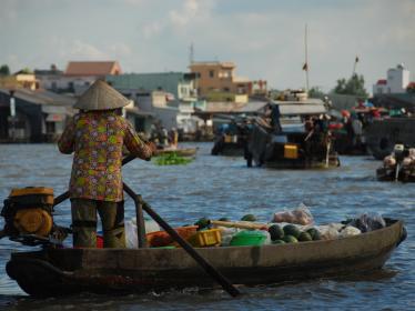 Woman in boat on Mekong Delta