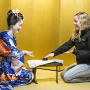 Playing drinking games with a maiko in a yellow room in Kyoto 