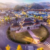 Aerial view of ornate building in middle of roundabout