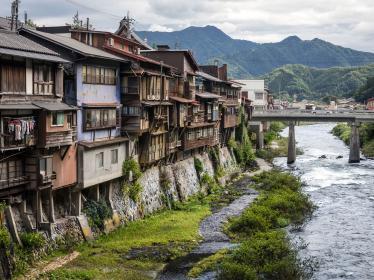 Wooden buildings at the side of the river