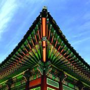 Pointed edge of ornate temple rooftop 