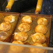 Takoyaki octopus balls cooked in trays