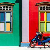 Motorbikes against coloured wall in Singapore