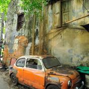 Orange vintage car street art on wall in Talad Noi, Bangkok 