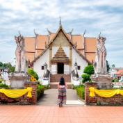 Girl outside temple in Nan, Thailand