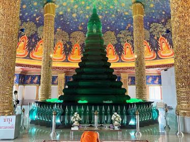 Monk praying inside temple in Bangkok