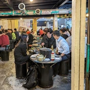 Three friends enjoying Korean street food
