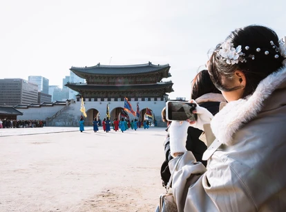 Woman in furs in Korea changing of the guard ceremony