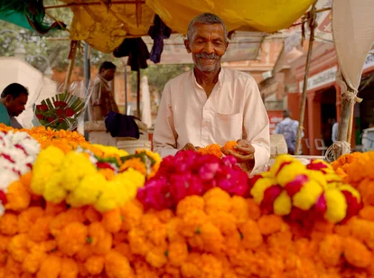 A friendly man in Jaipur at a marigold store in October