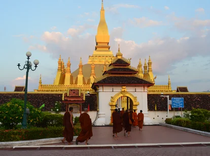 Monks arriving to a temple in February Laos