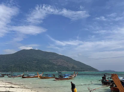 Thailand Ko Lipe beach and boats in clear blue water during February 