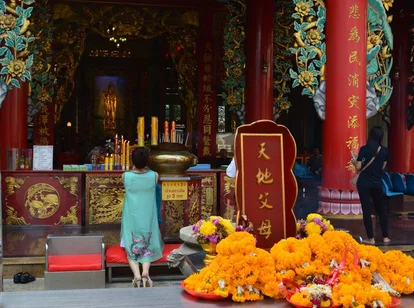 Woman Praying in Temple in Bangkok