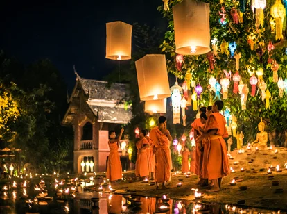 Monks celebrating Thailand festival with lanterns