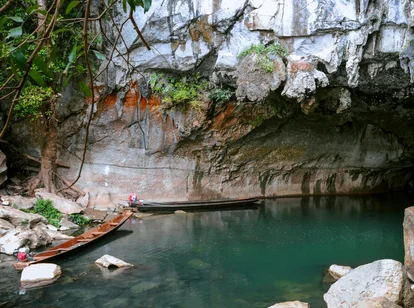 Cave entrance with two boats at Tham Kong Lor caves