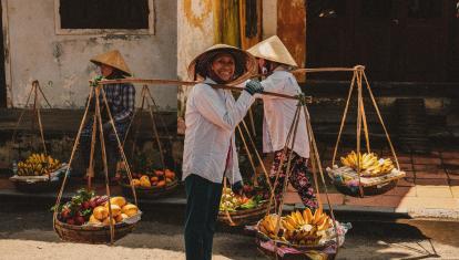 Women carrying bananas in Vietnam