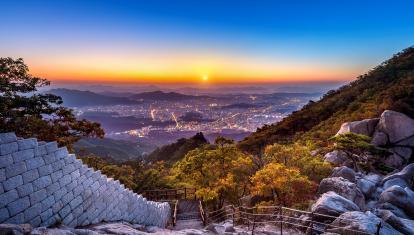 Sunrise from peak in Bukhansan mountains overlooking Seoul