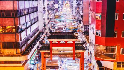 Aerial view of night market in middle of street in Hong Kong 