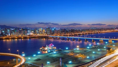 Calm waters under Yeongdong Bridge near Gangnam at night in Seoul, South Korea