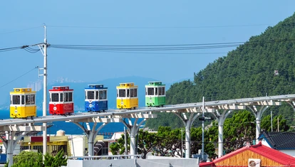 Cute and colorful little trams are lined up in Haundae's Blue Park in Busan, South Korea