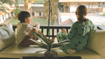 Children in elephant sanctuary glamping Thailand