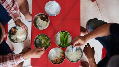 Local Vietnamese eating traditional street food