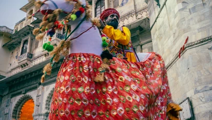 Indian man in traditional dress on a horse