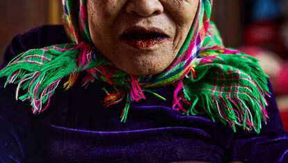 Vietnamese lady offering shot glass
