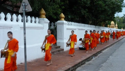 Young monks alms giving