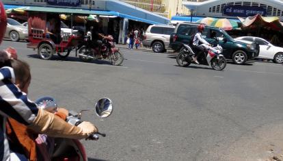 Travelling to Phsar Thmey market on the back of a motorbike