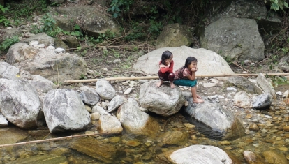 Young girls watching on as we bathed in Nam Cam river