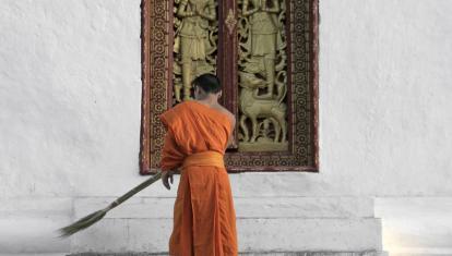 Laos- monk sweeping