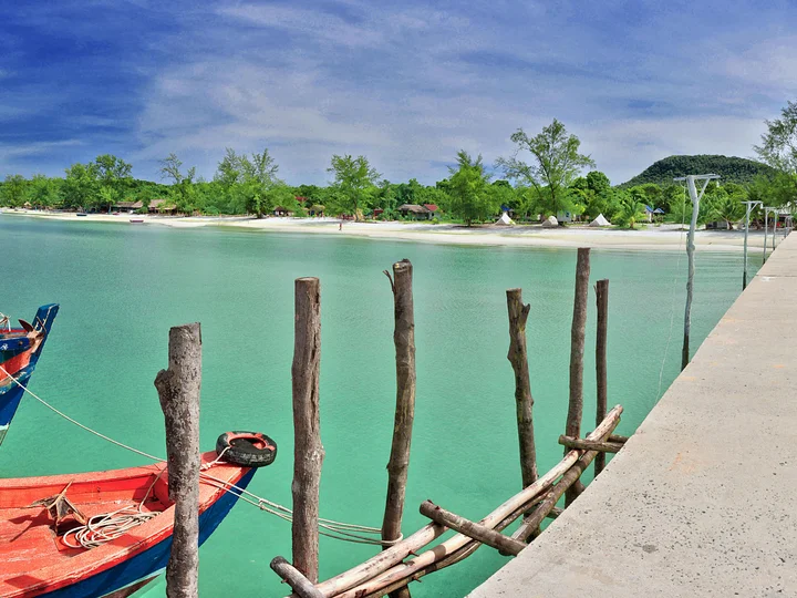 A wooden pier over turquoise water in Koh Rong