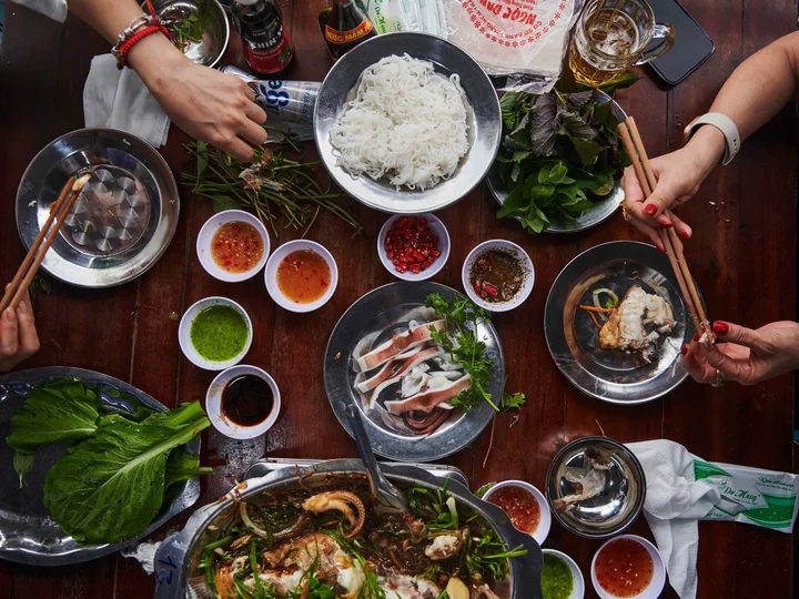 Local Vietnamese women sharing traditional food in Vietnam