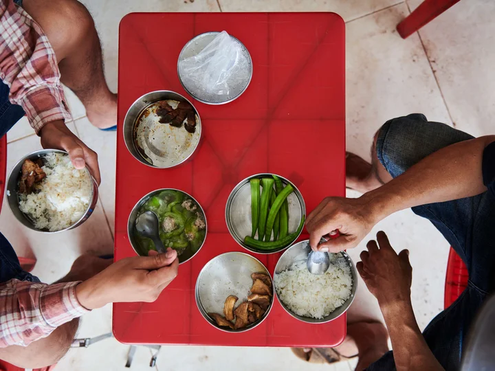 Local Vietnamese eating traditional street food