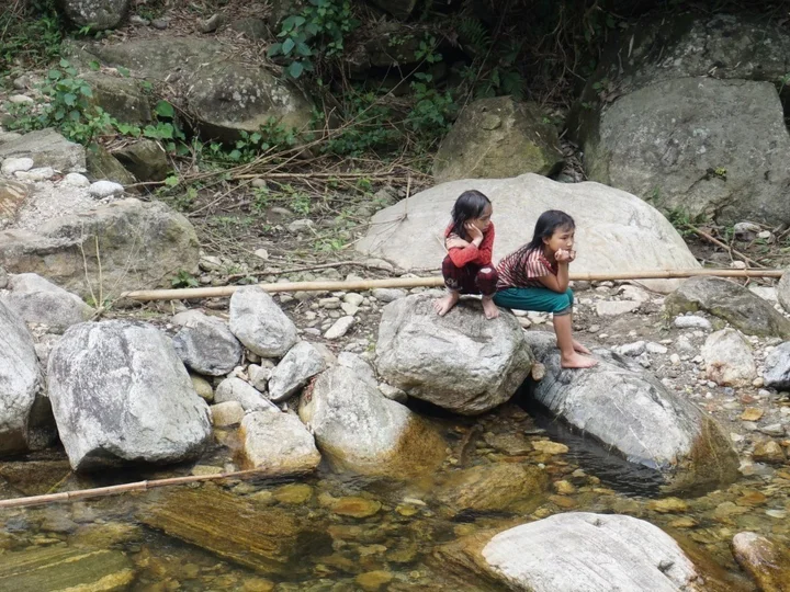 Young girls watching on as we bathed in Nam Cam river