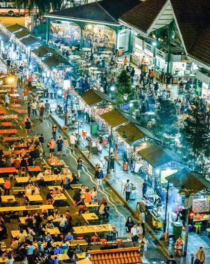 Aerial view of people eating at outside tables at Hawker Centre