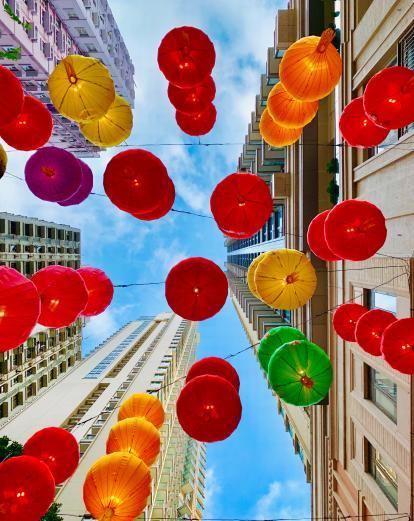 Looking up at lanterns and skyscrapers 