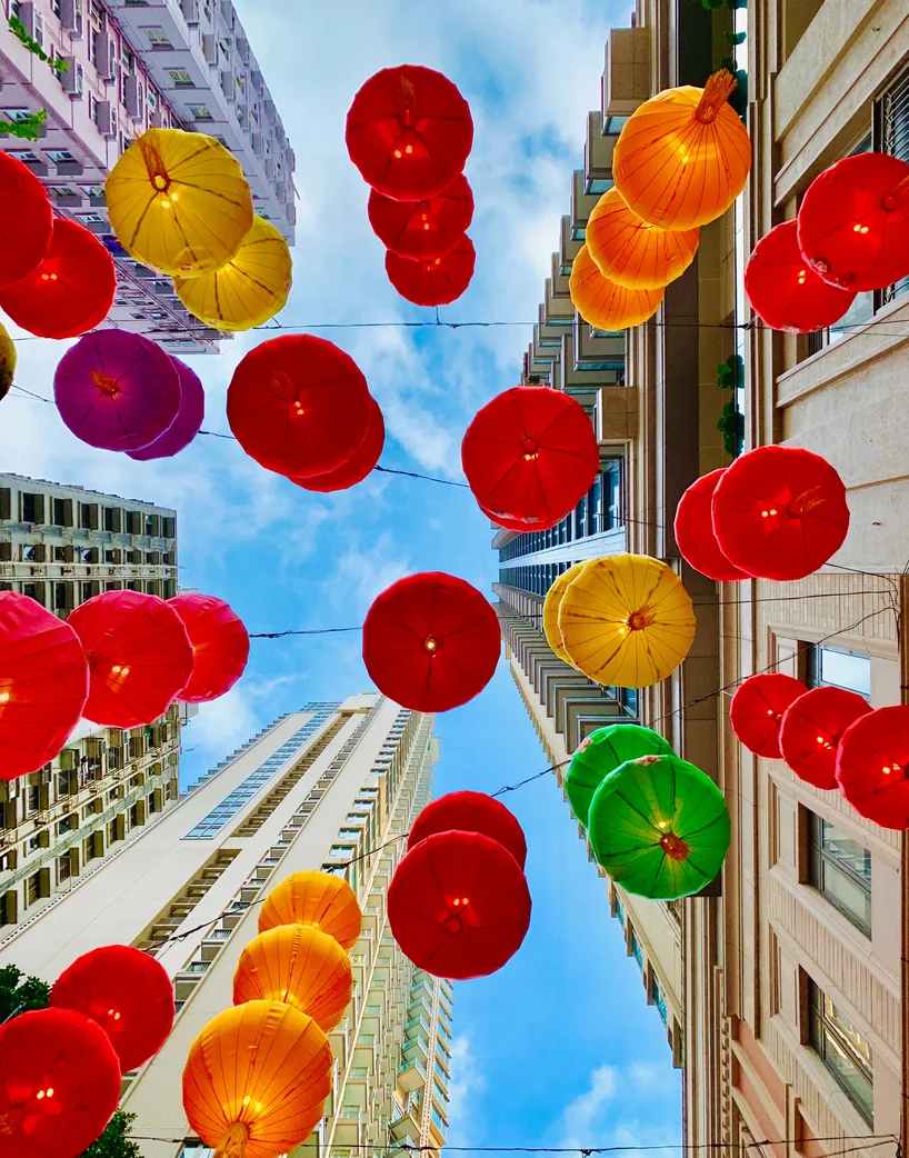 Looking up at lanterns and skyscrapers 